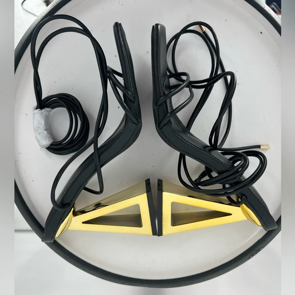 FASHION NOVA STAY WINNING WRAP UP HEELS ‎ IN BLACK GOLD NOVELTY HEELS
